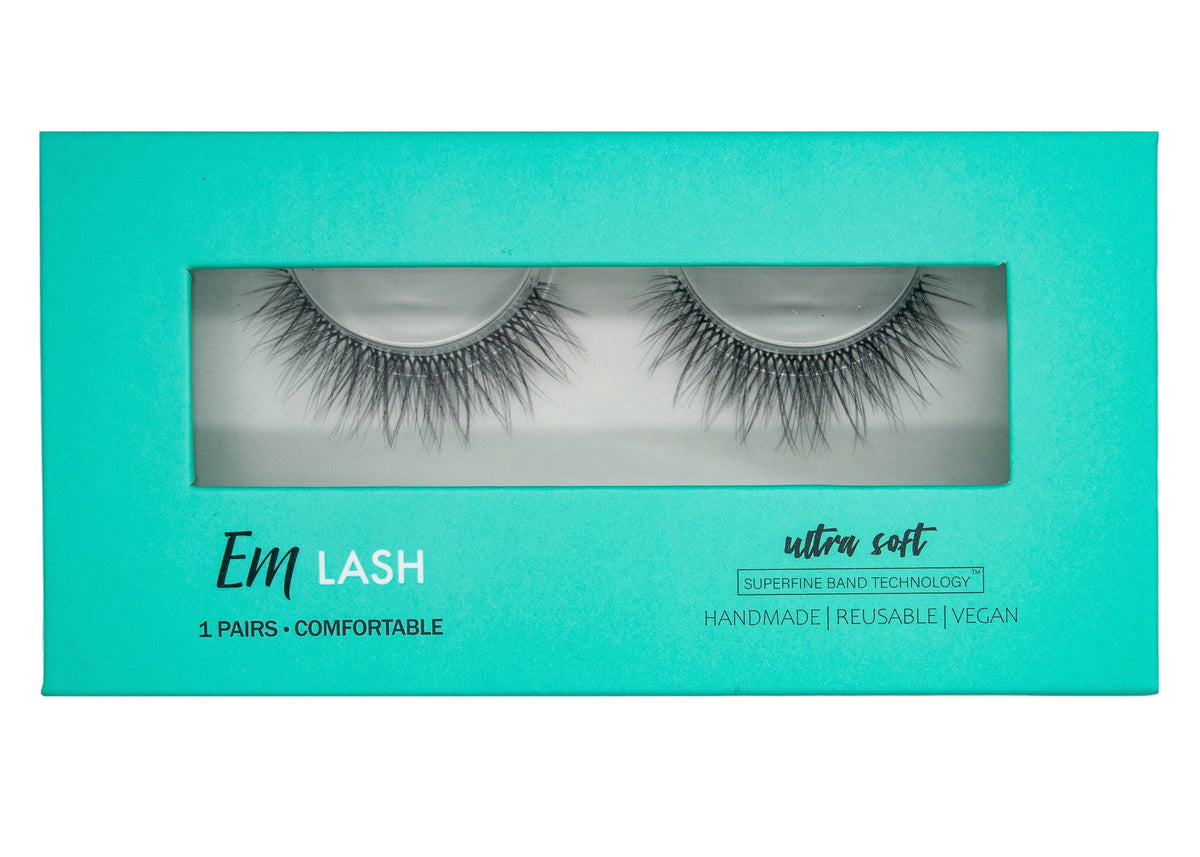Em Lash Ultra Soft reusable false eyelashes in a bright turquoise packaging box with a clear window showing the lashes inside.