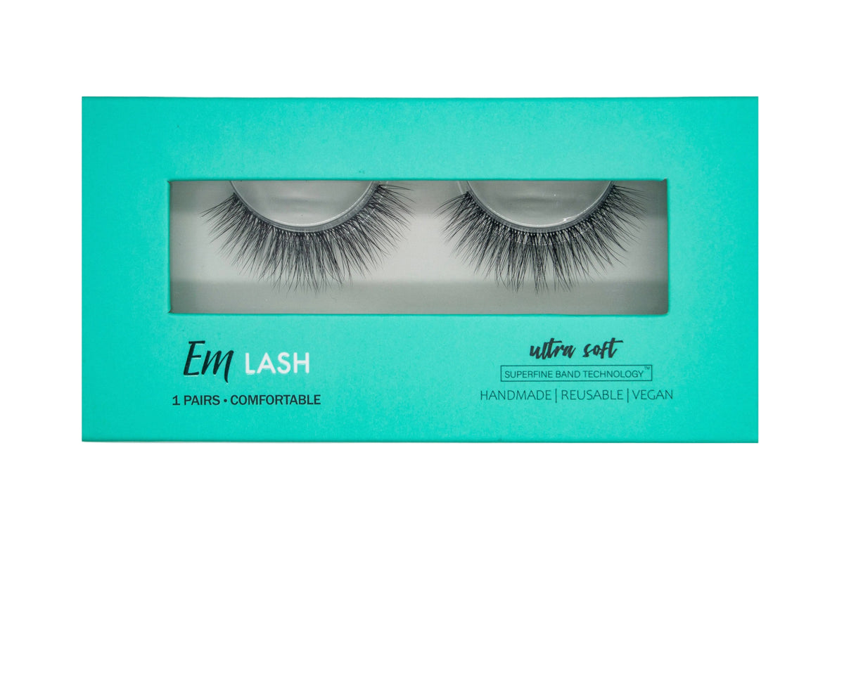 Em Lash ultra soft false eyelashes in a turquoise rectangular box with a clear window showing the lashes inside.