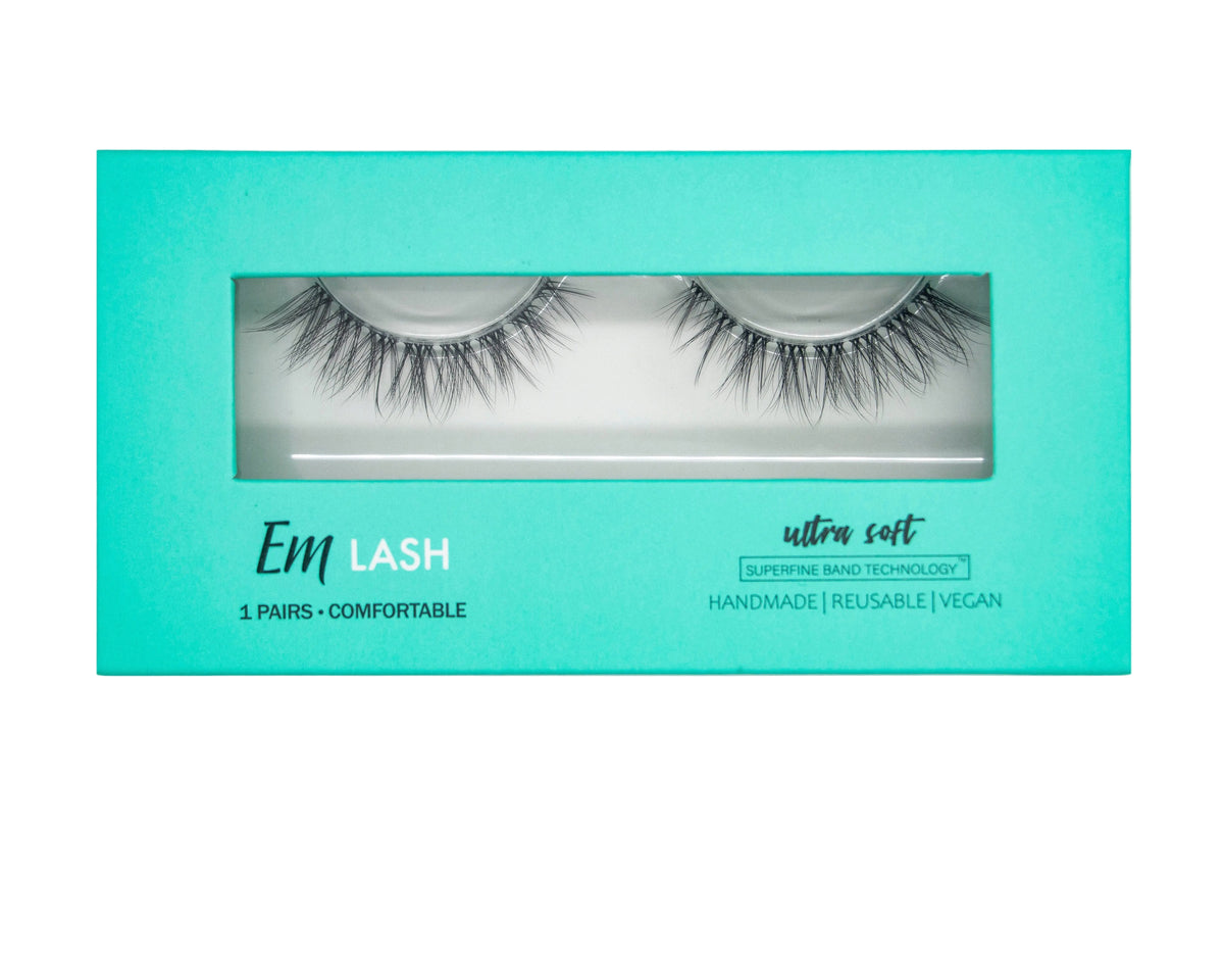 Em Lash ultra soft reusable vegan false eyelashes in a bright turquoise box with a clear window showing the lashes inside.