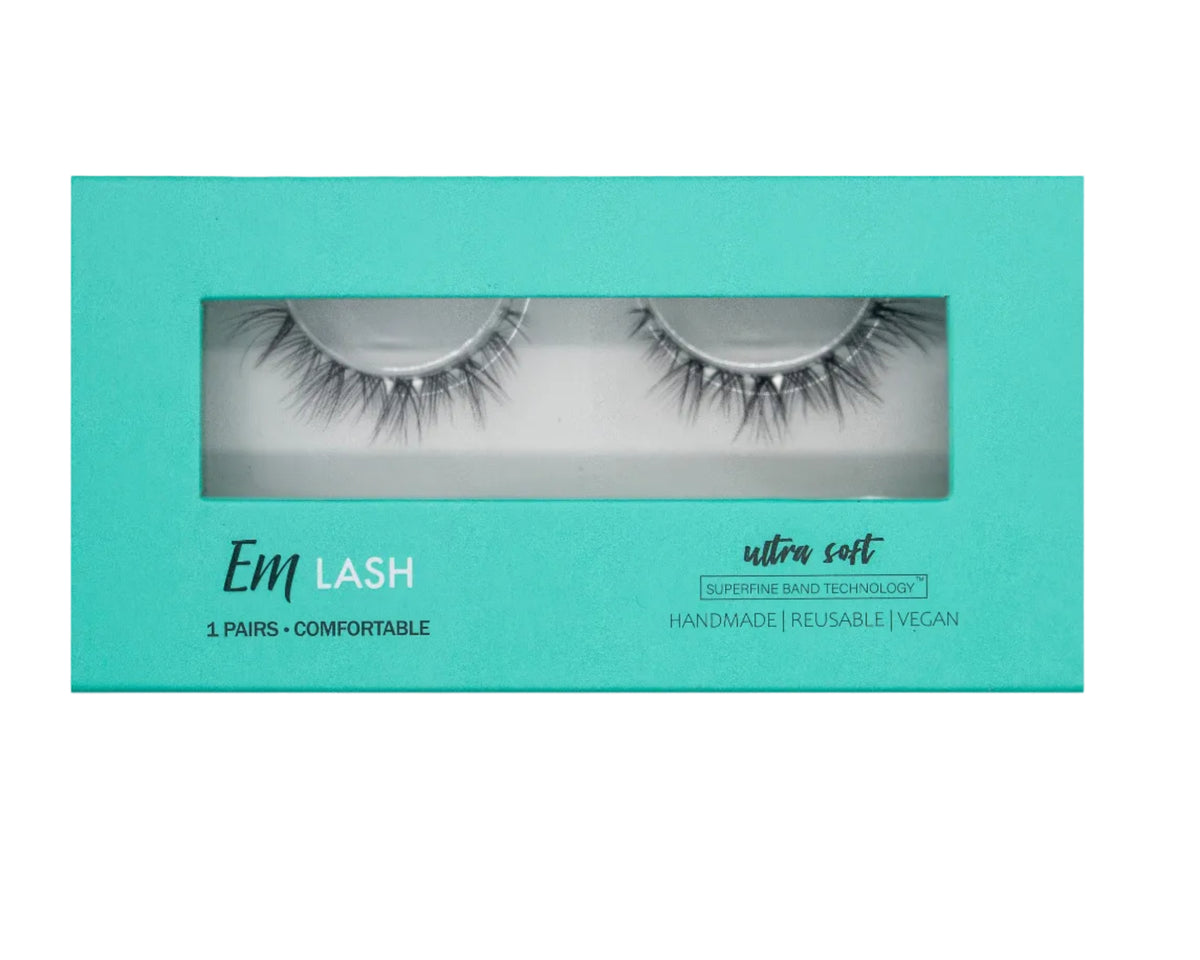 Em Lash ultra soft false eyelashes in a teal rectangular window box packaging, shown against a solid gray background.
