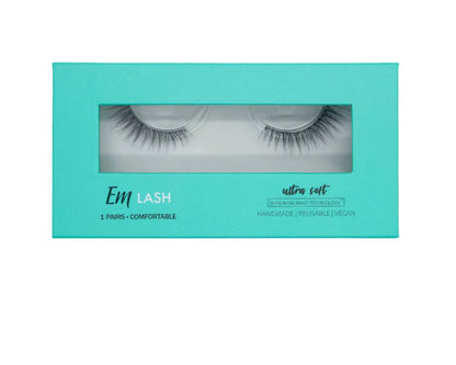 Em Lash ultra soft false eyelashes in a turquoise window box packaging, shown against a solid gray background.