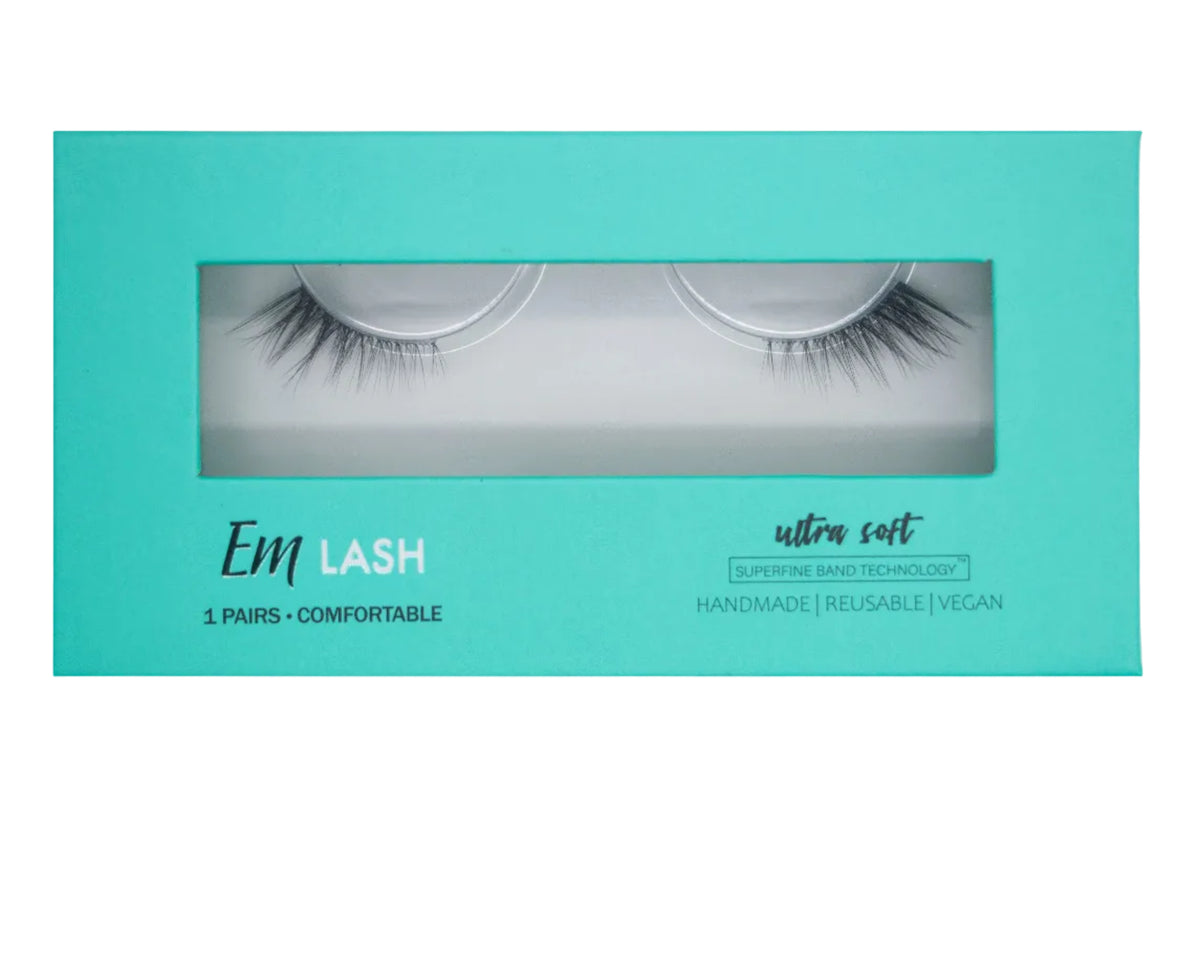 Em Lash Ultra Soft reusable false eyelashes in a mint green cardboard box with a clear window showing the lashes inside.