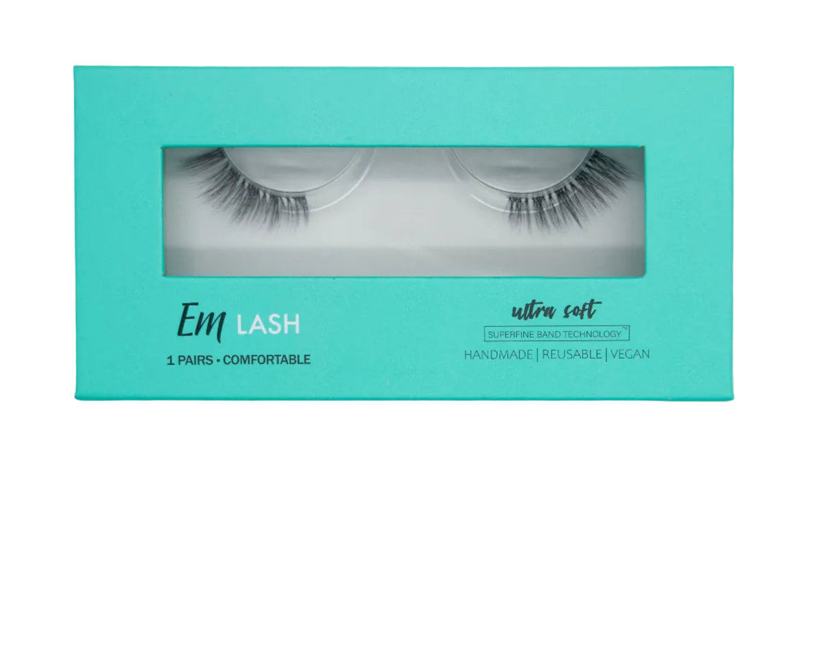 Em Lash ultra soft 1-pair false eyelashes in a turquoise packaging box, shown against a solid gray background.