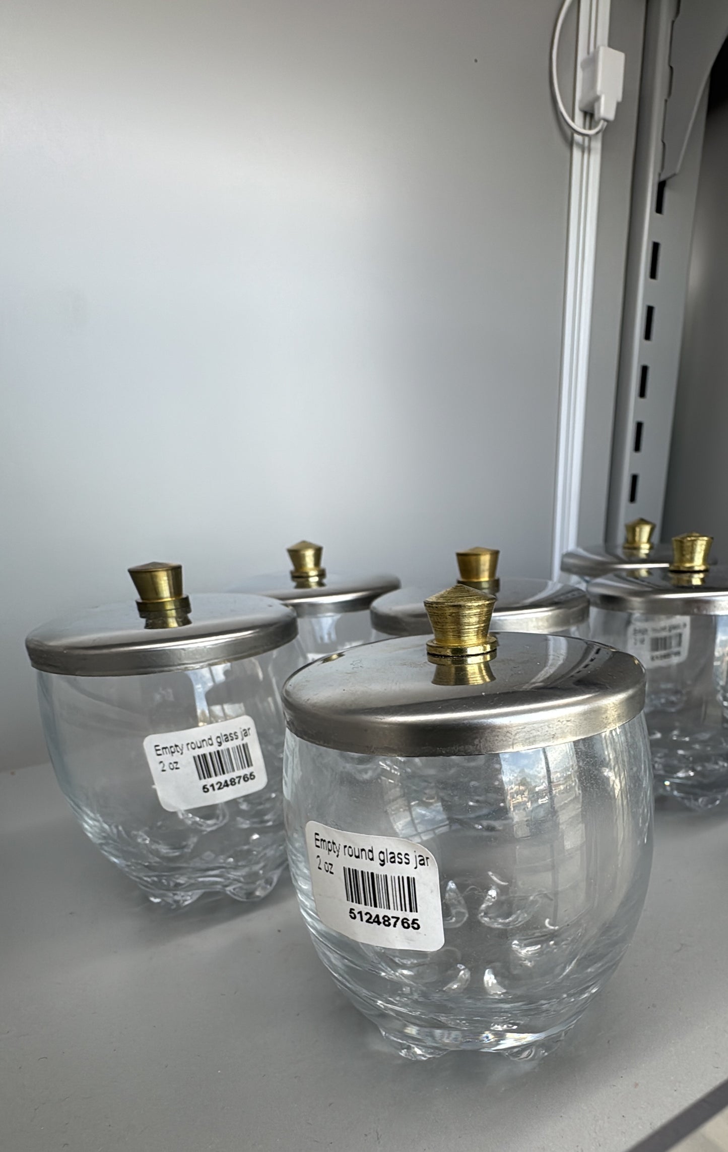 Empty round glass jar 2 oz