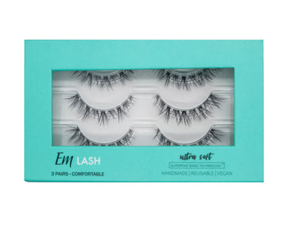 Em Lash Ultra Soft 3-pair set of false eyelashes in a turquoise window box package, shown against a neutral gray background.
