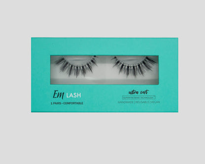 A pair of black false eyelashes in a turquoise rectangular box with a clear window. The box features the brand name 'Enrl LASH' and text reading 'ultra soft'.