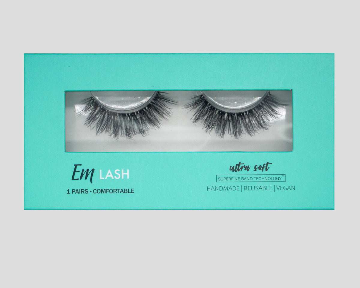 Em Lash Ultra Soft reusable false eyelashes in a turquoise packaging box, shown against a neutral gray background.