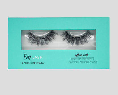 Em Lash Ultra Soft reusable false eyelashes in a turquoise packaging box, shown against a neutral gray background.